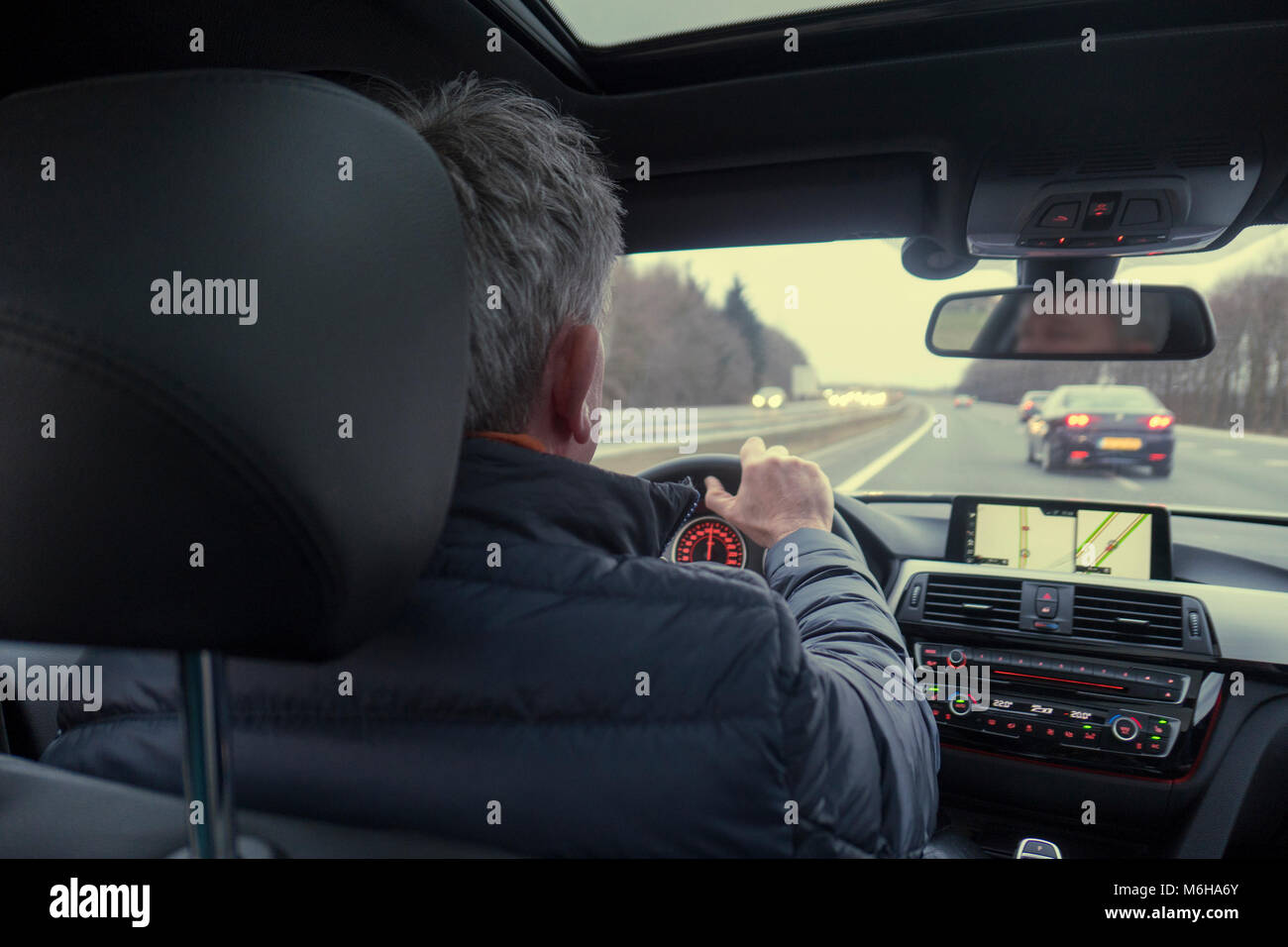 Man inside car driving on highway Stock Photo Alamy