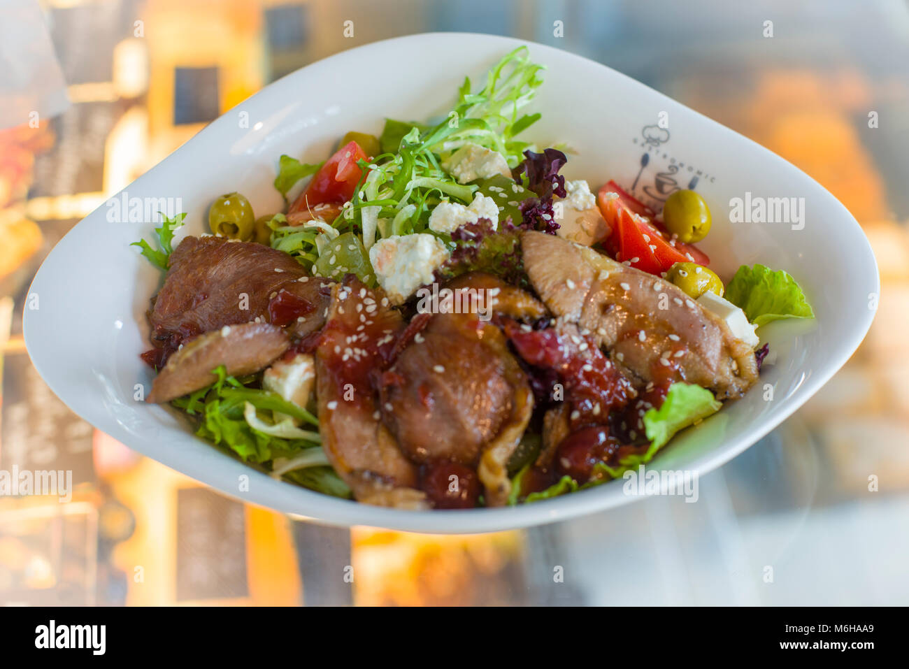 MIxed vegetable and meat salad in elegant dish Stock Photo