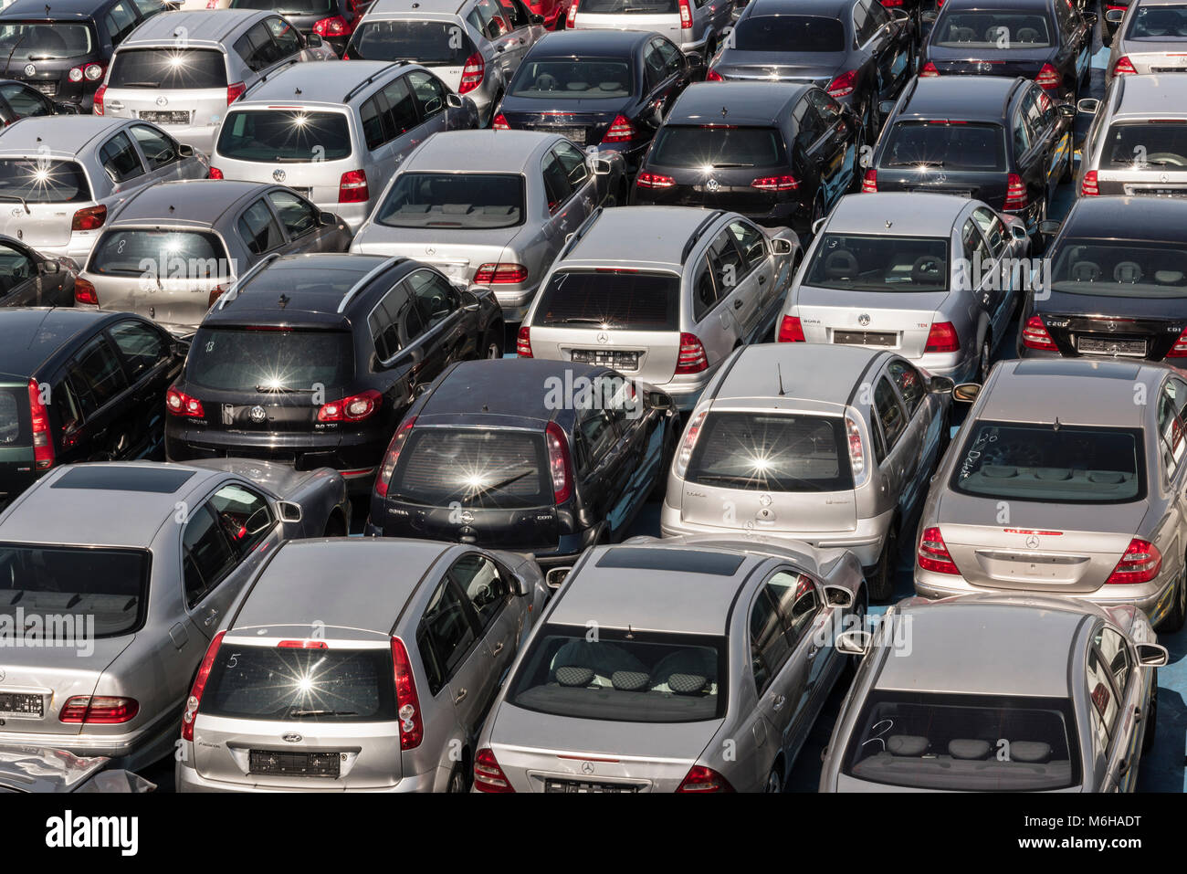 Ancona, Italy - July 27, 2017: Cars without license plate strung together on the deck of the ferry, Car shipping from Ancona to Durres Stock Photo