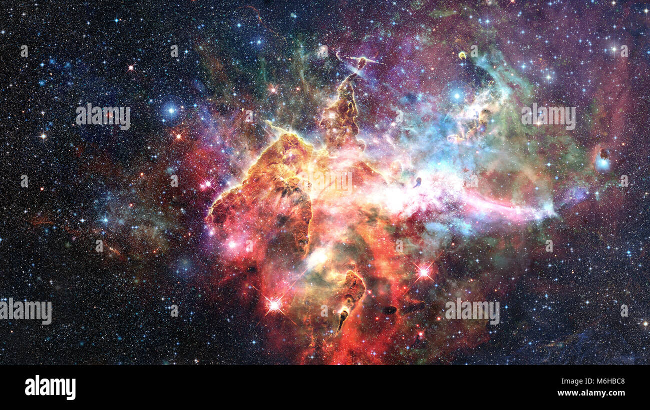 Mystic Mountain. Region in the Carina Nebula imaged by the Hubble Space Telescope. Elements of this image furnished by NASA. Stock Photo