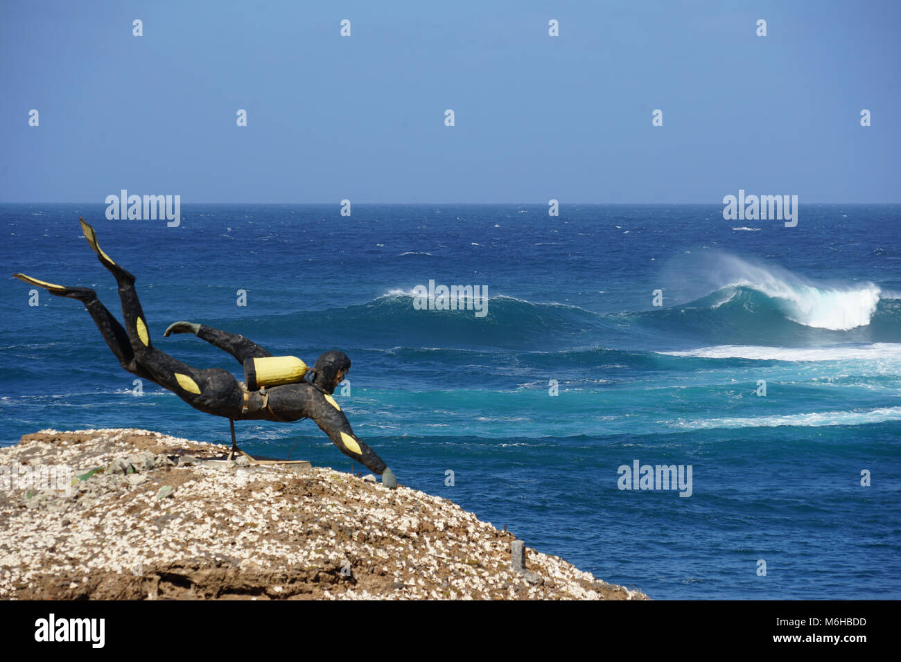 Scuba Diver Statue on a rock, facing the Sea, Ponta do Sol, Santo Antao, Cape Verde Stock Photo