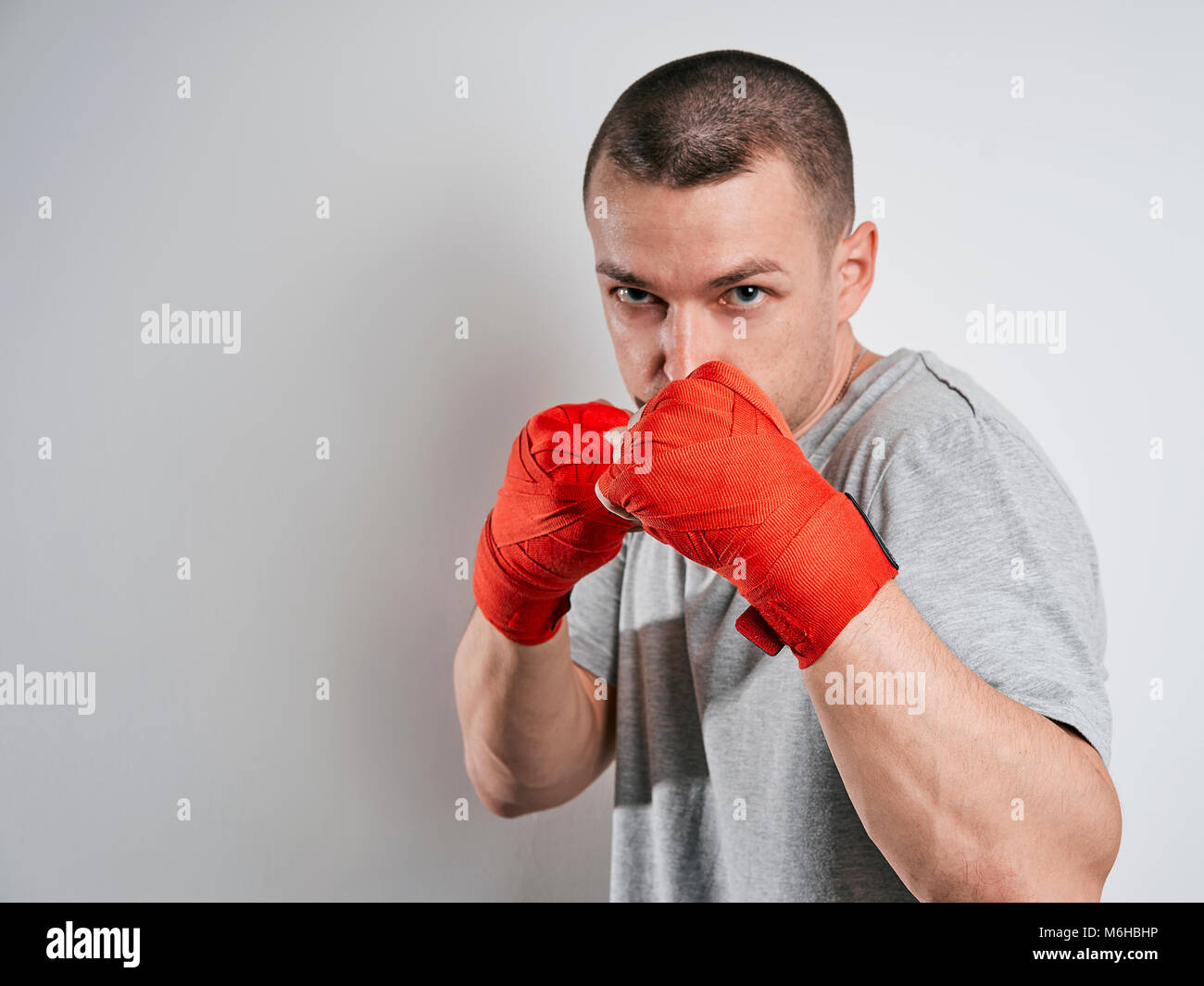man in red Boxing bandages white background Stock Photo