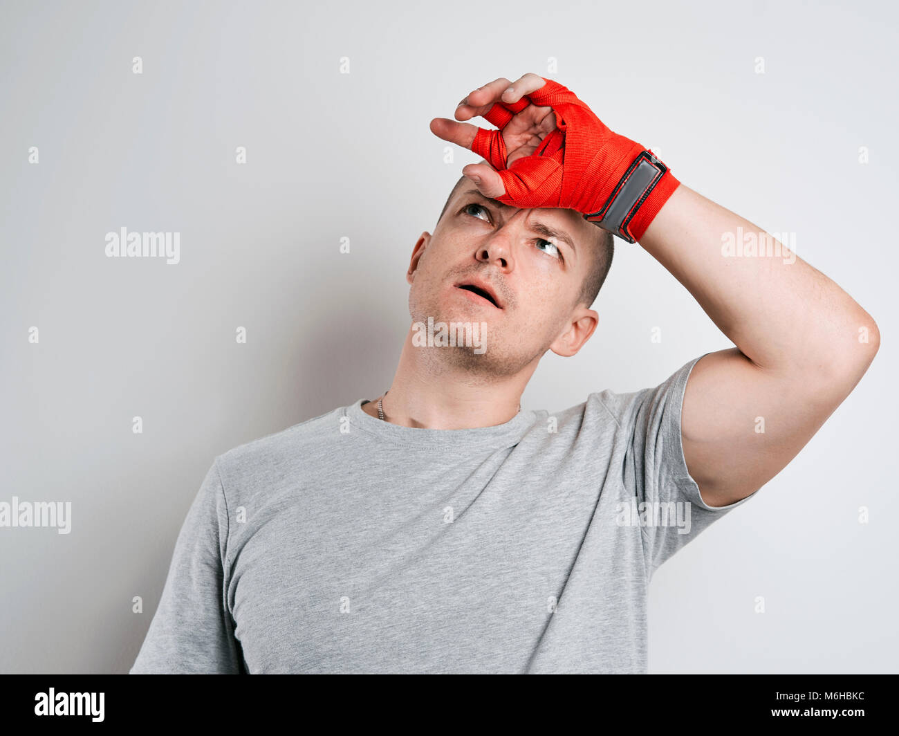 man in red Boxing bandages white background Stock Photo