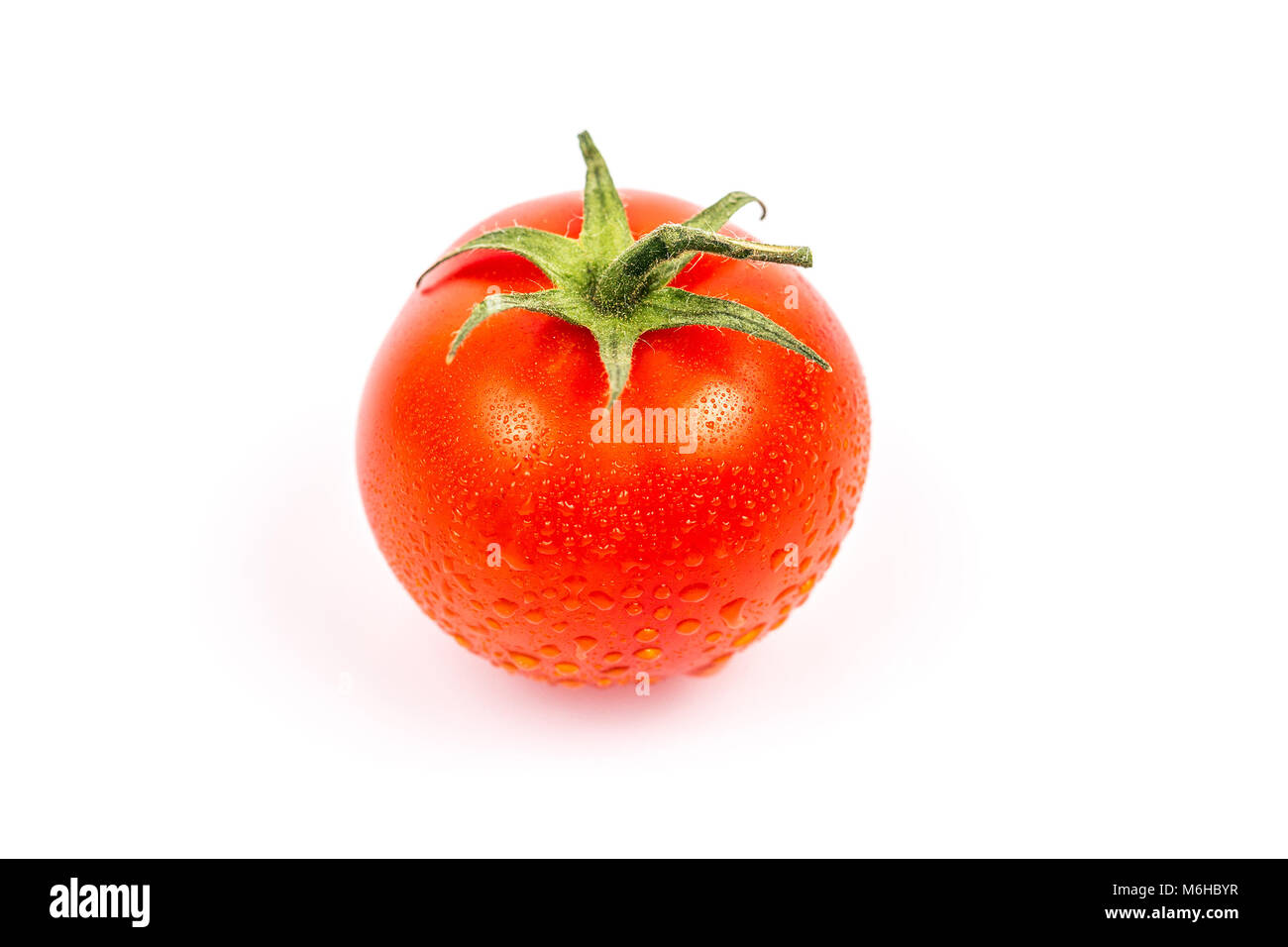 Tomato with water drops isolated on white background Stock Photo - Alamy