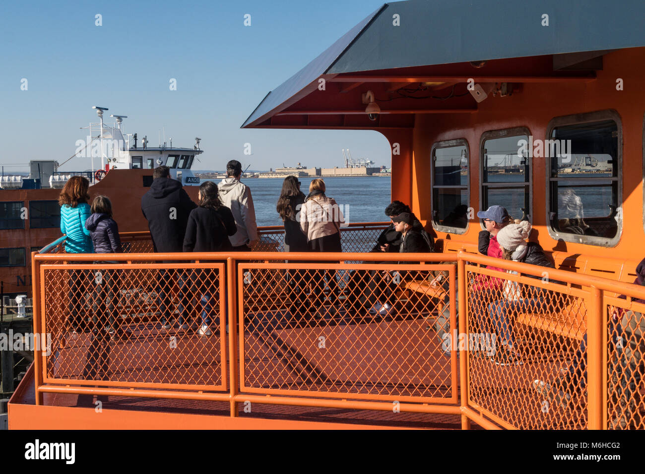 Tourists aboard the Staten Island Ferry in New York Harbor, NYC, USA Stock Photo