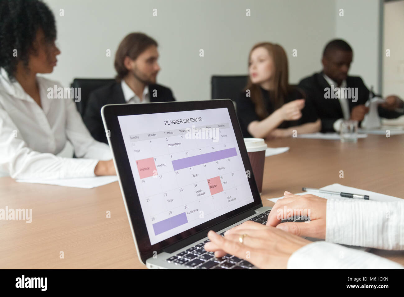 Woman planning work or making events schedule with planner calen Stock