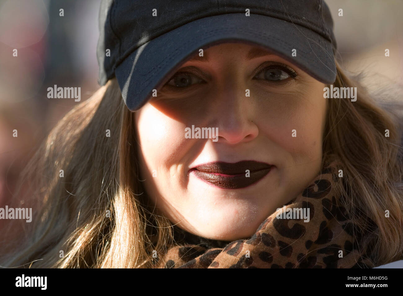 Smiling woman taking part in the women's march on London, January 2017 Stock Photo