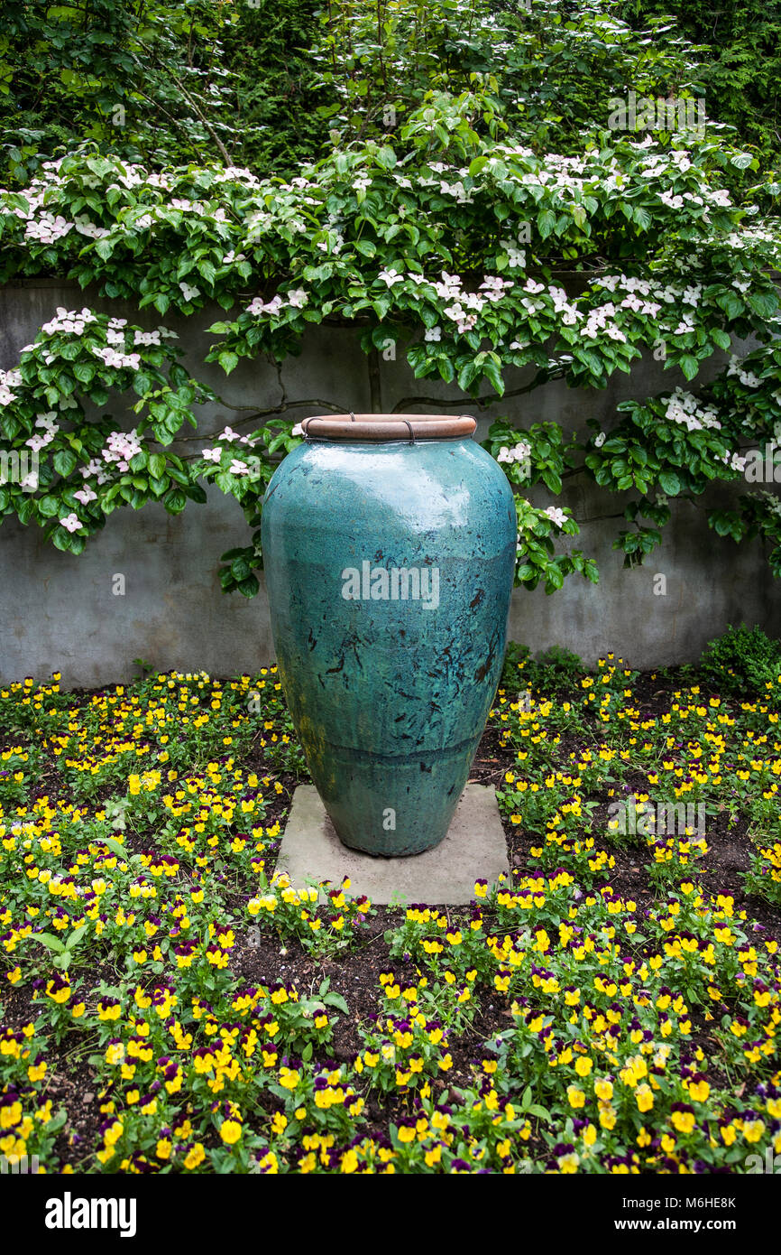 Spring flowers vase, garden urn pottery container display, Chanticleer Botanical Garden, Wayne, Pennsylvania, USA, landscaping container gardens urn Stock Photo