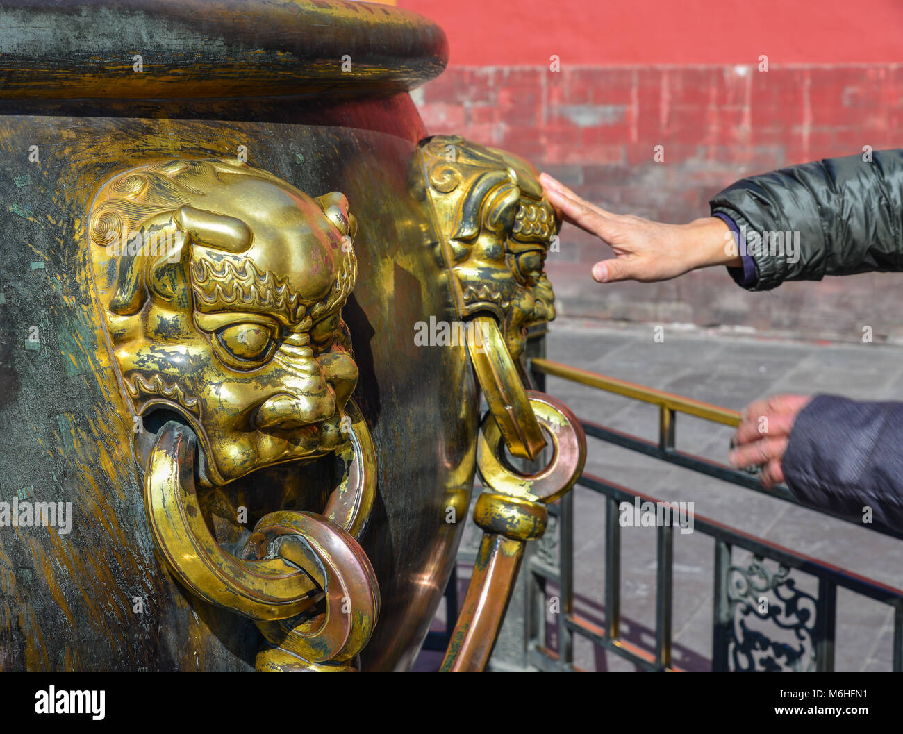 Cloes-up of ornate bronze lion head handle on water urn at the Entrance to the Gate of Heavenly Purity in Forbidden City, Beijing, China. Stock Photo