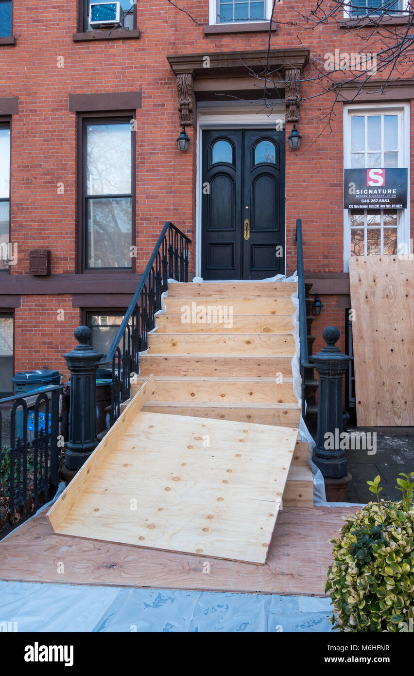 Brooklyn brownstone front steps being repaired Stock Photo - Alamy