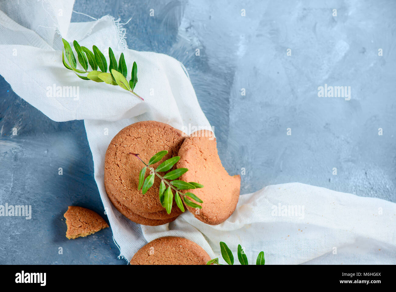 Oatmeal cookie close-up. Biscuits on a stone background with copy space. Healthy breakfast concept from above. Stock Photo