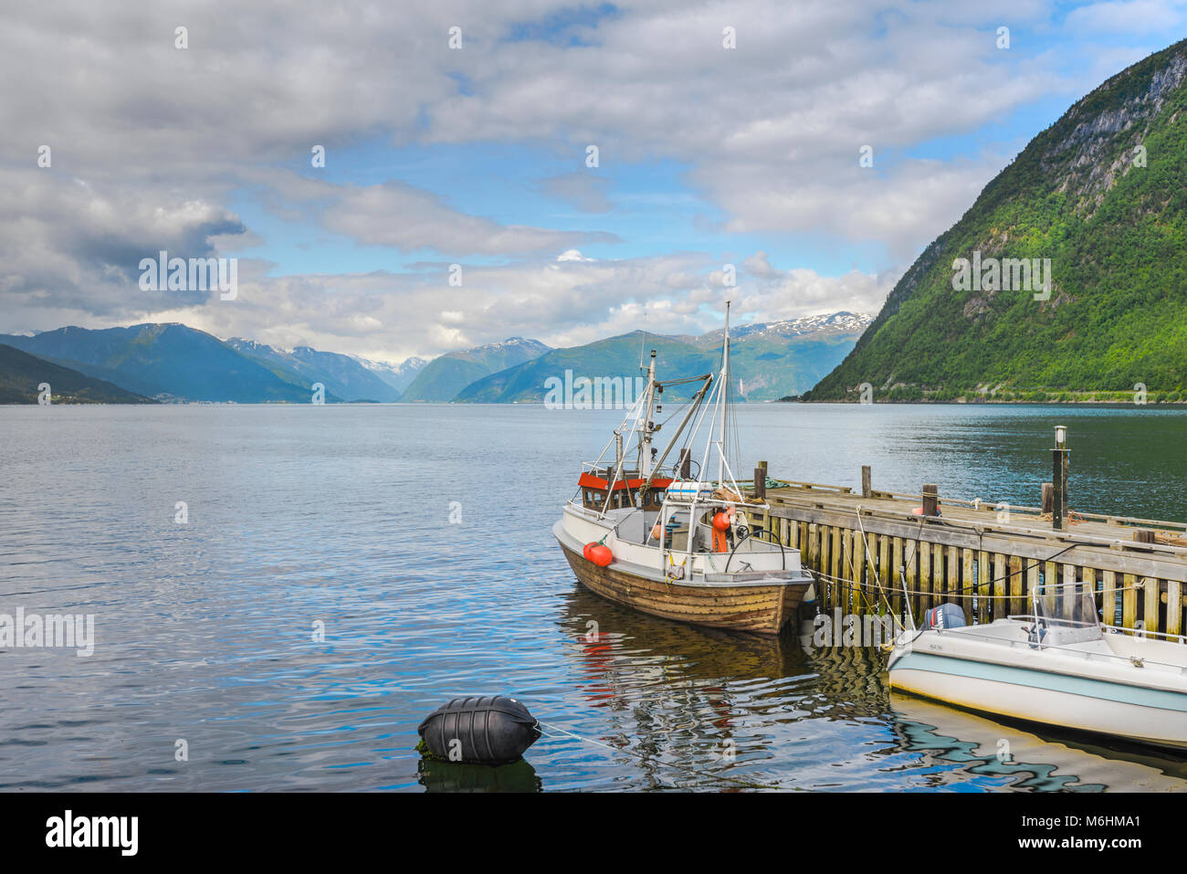 fisher boat with panorama of the Sognefjord and the surrounding mountains, Norway, landing stage of Vik i Sogn Stock Photo