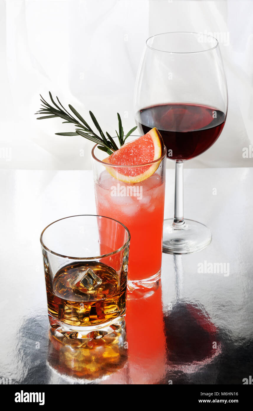 Paloma cocktail in Collins Glass, from tequila with grapefruit juice,  decorated with a slice of grapefruit and rosemary.Whiskey in rocks glass  with i Stock Photo - Alamy