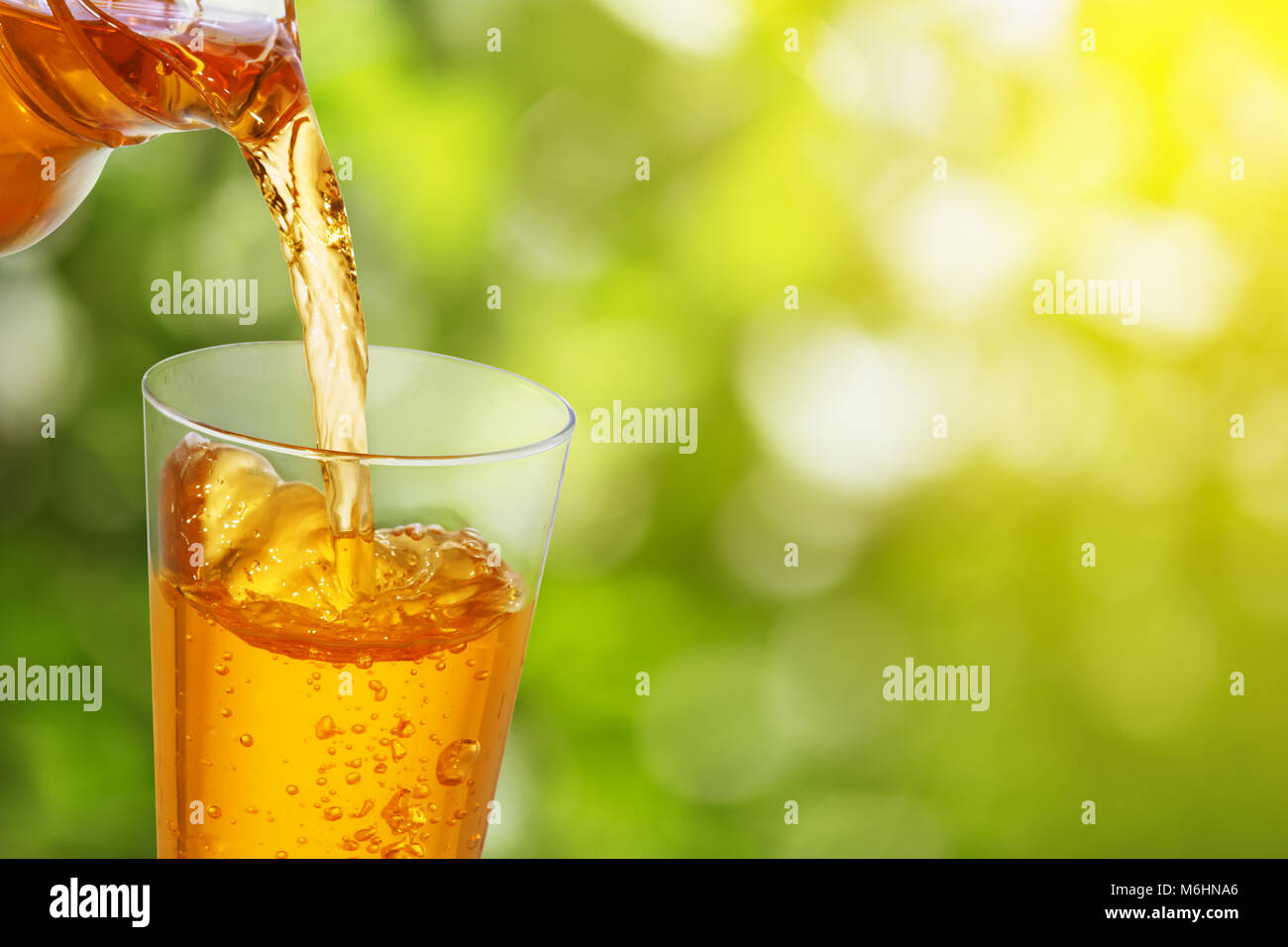 pouring apple juice Stock Photo Alamy