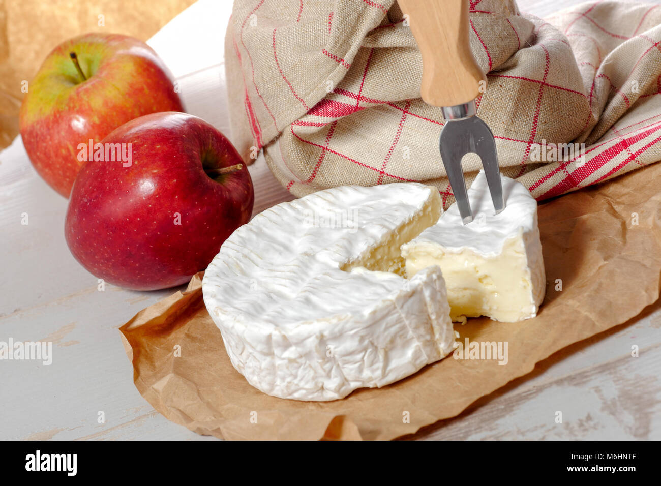 camembert of Normandie with red apple Stock Photo Alamy