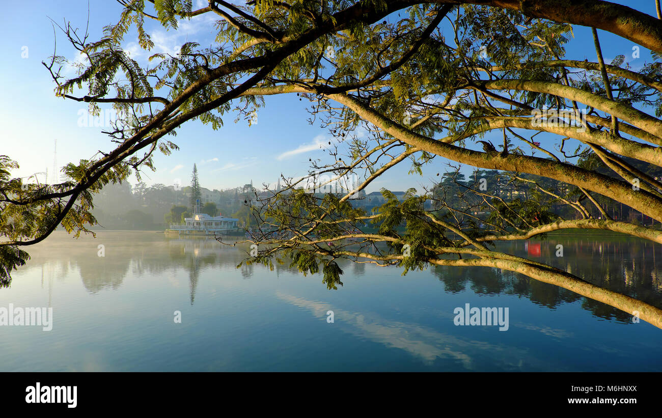 Thuy Ta restaurant of Da Lat city view from branch of flamboyant tree, old and small restaurant also symbol of Dalat that located on Xuan Huong lake Stock Photo