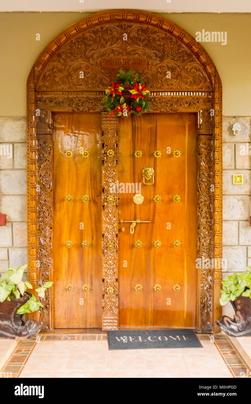 Indian Style Wooden Archway And Entrance Door With Two Windows And Two Flowerpot Shoes In Nairobi City Kenya Stock Photo Alamy
