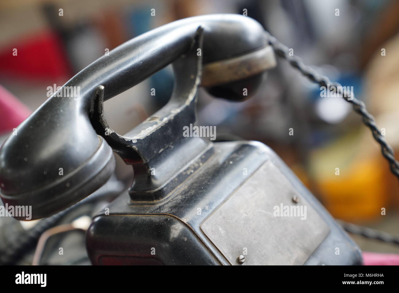 Old vintage antique black phone with rotary disc back Stock Photo