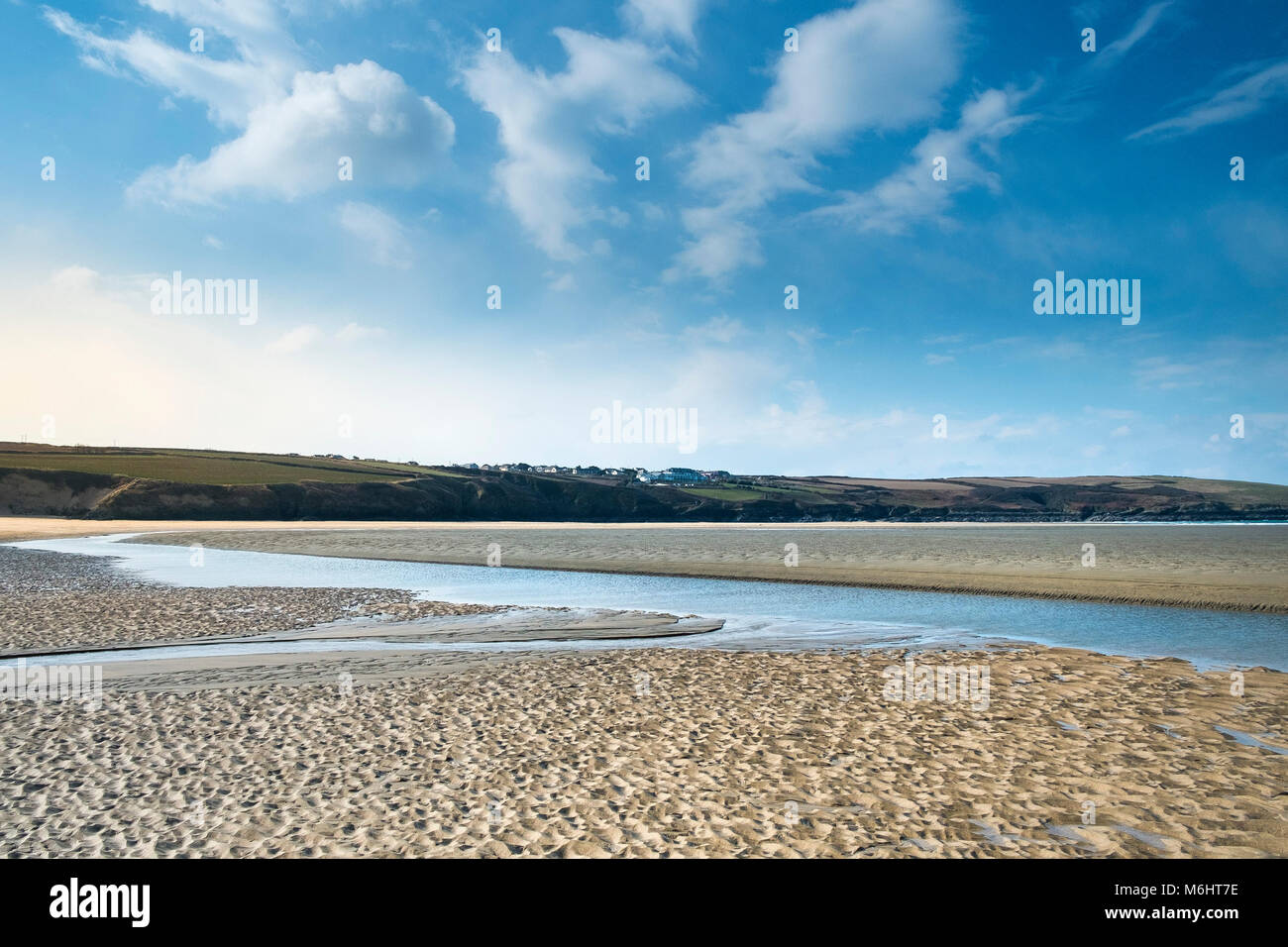 The Gannel River flowing across Crantock Beach in Newquay Cornwall. Stock Photo