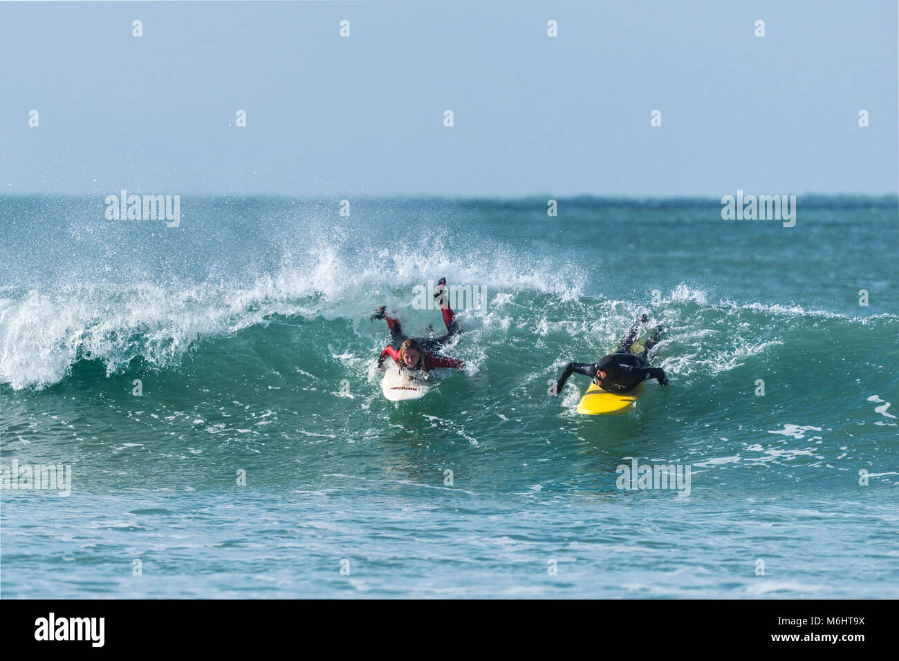 A surf instructor teaching a young surfer at Fistral Newquay Cornwall Stock Photo Alamy