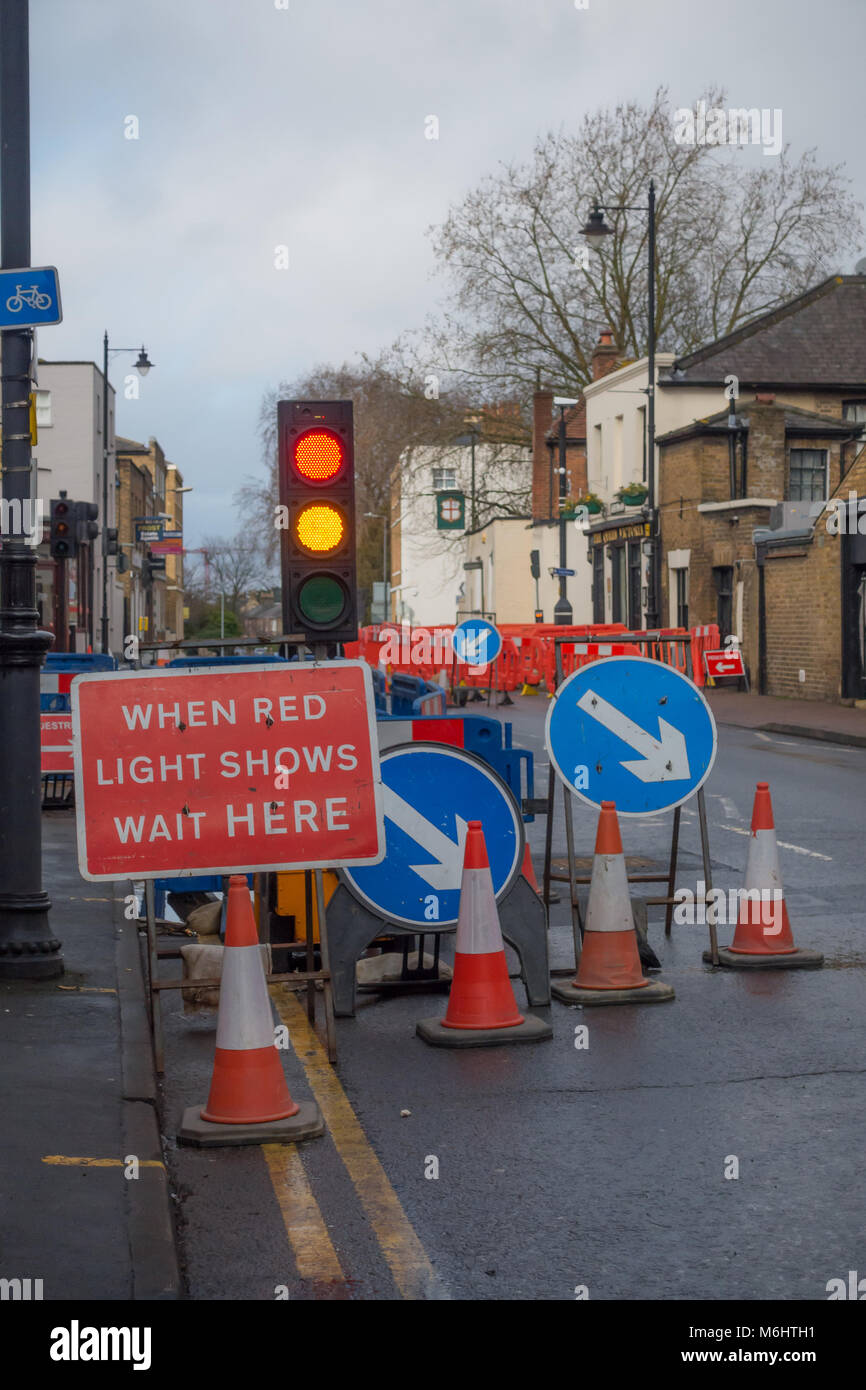 Roadworks on Victoria Street in Windsor cause delays to road uses who have to wait their turn at a set of temporary traffic lights. Stock Photo