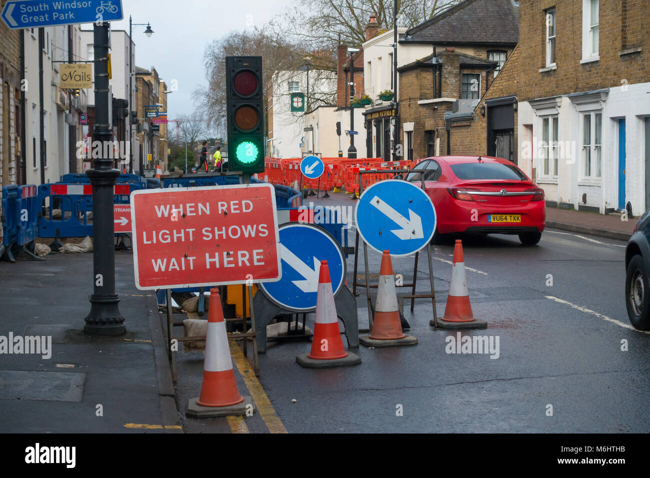 Roadworks on Victoria Street in Windsor cause delays to road uses who have to wait their turn at a set of temporary traffic lights. Stock Photo