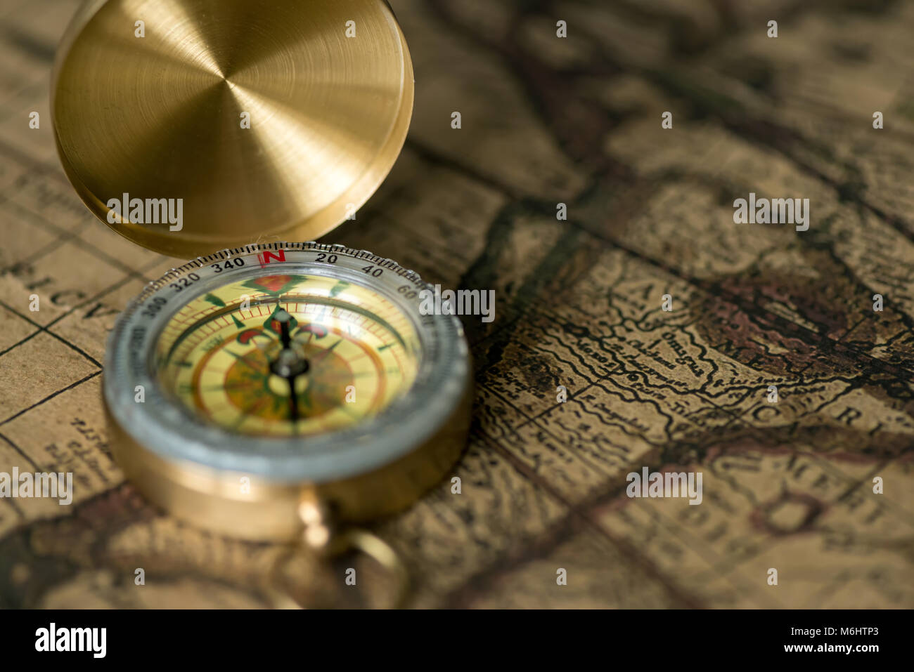 Old compass on map hi-res stock photography and images - Alamy