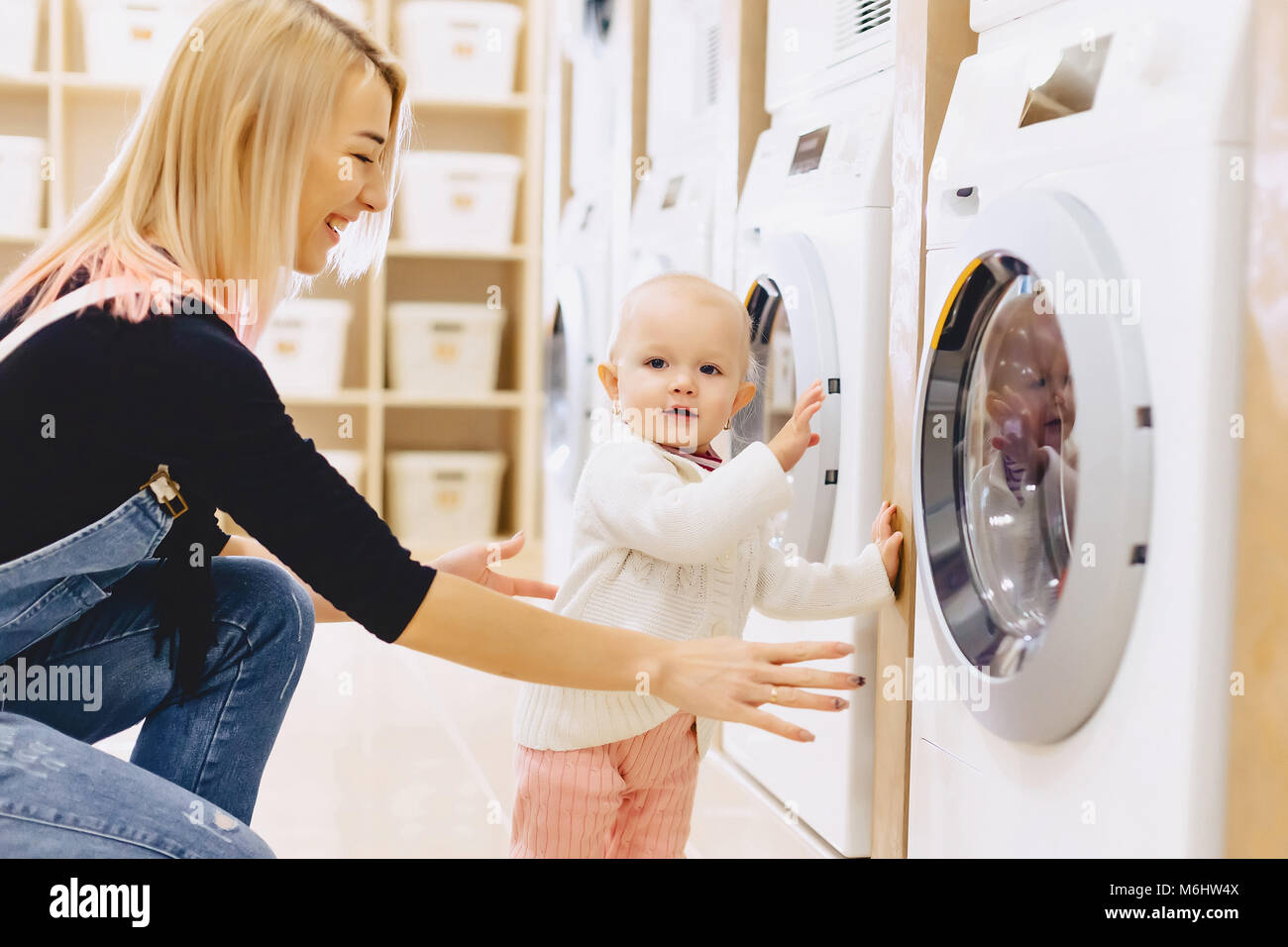 Funny Photos of a Mom Going Down a Laundry Shoot