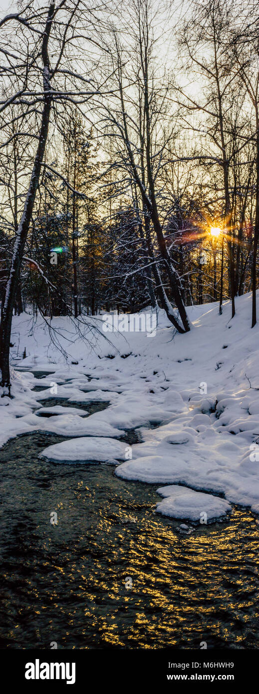 Calm Winter Photo of a Partly Frozen River with a Sun Shining in Camera ...