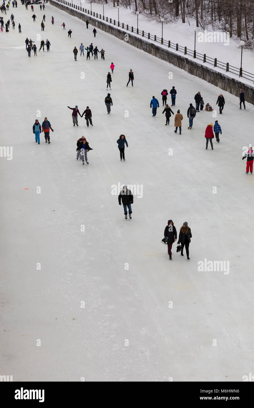 Ottawa, Ontario, Canada - January 20 2018: Skaters and people walking on the Rideau Canal Stock Photo