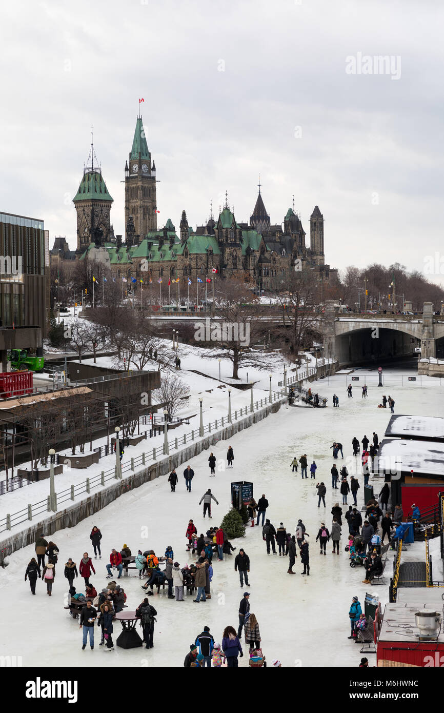 Ottawa, Ontario, Canada - January 20 2018: Rideau Canal with the Parliament Hill in the Background Stock Photo