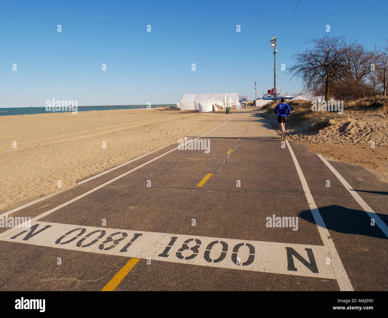 Street number marking on the lakefront bicycle and jogging trail at North Avenue Beach. Chicago, Illinois. Stock Photo