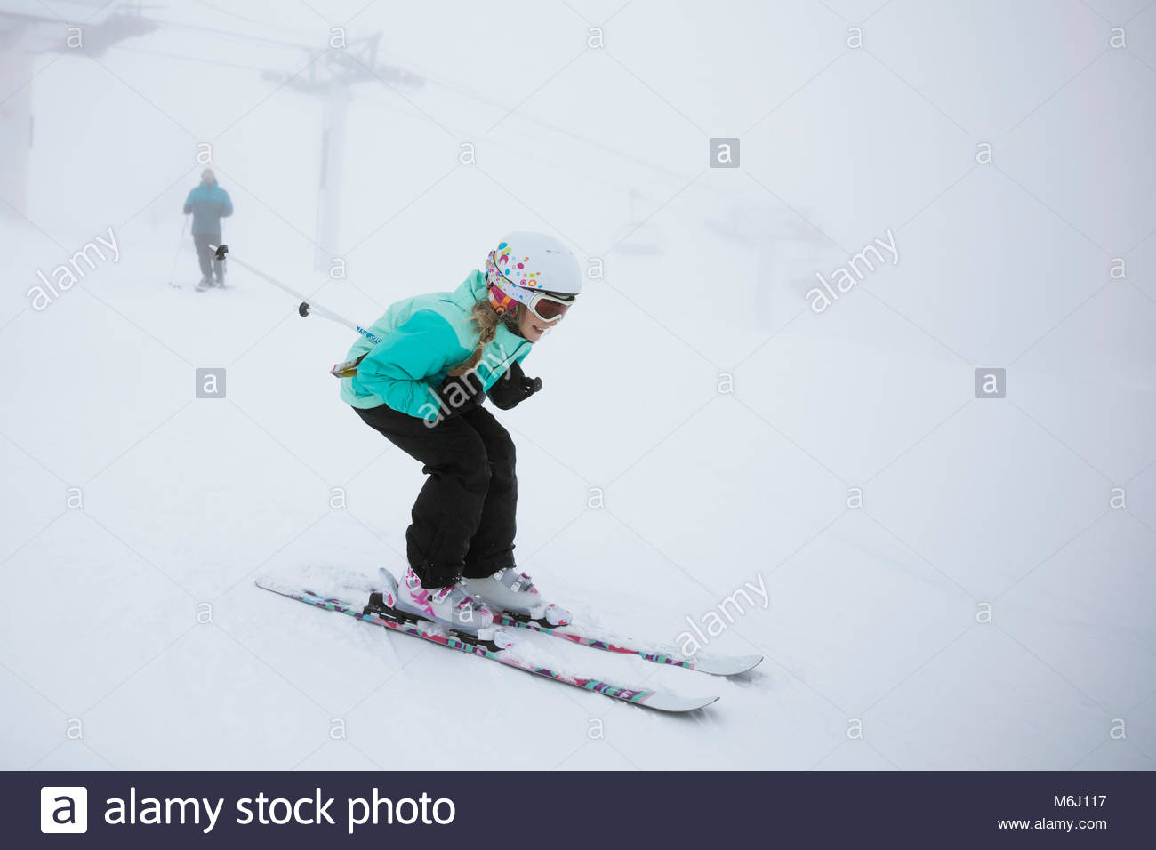 Girl skier skiing in snow Stock Photo