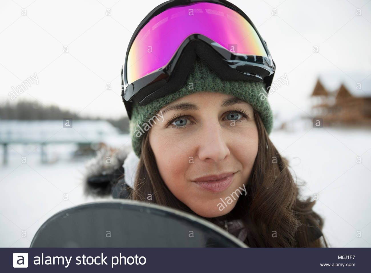 Portrait confident female snowboarder Stock Photo