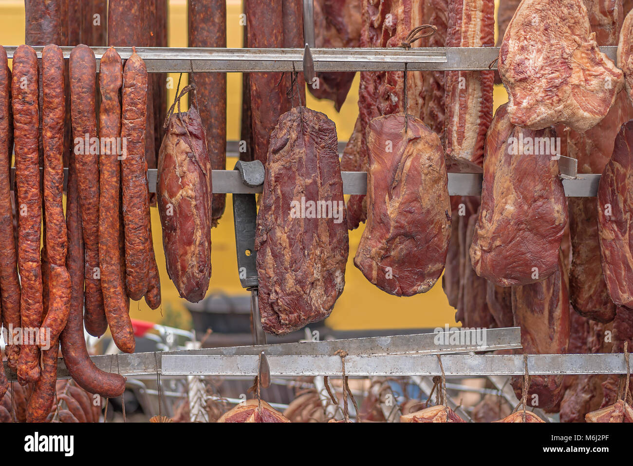 Hanging Smoked pork meat, shallow focus Stock Photo