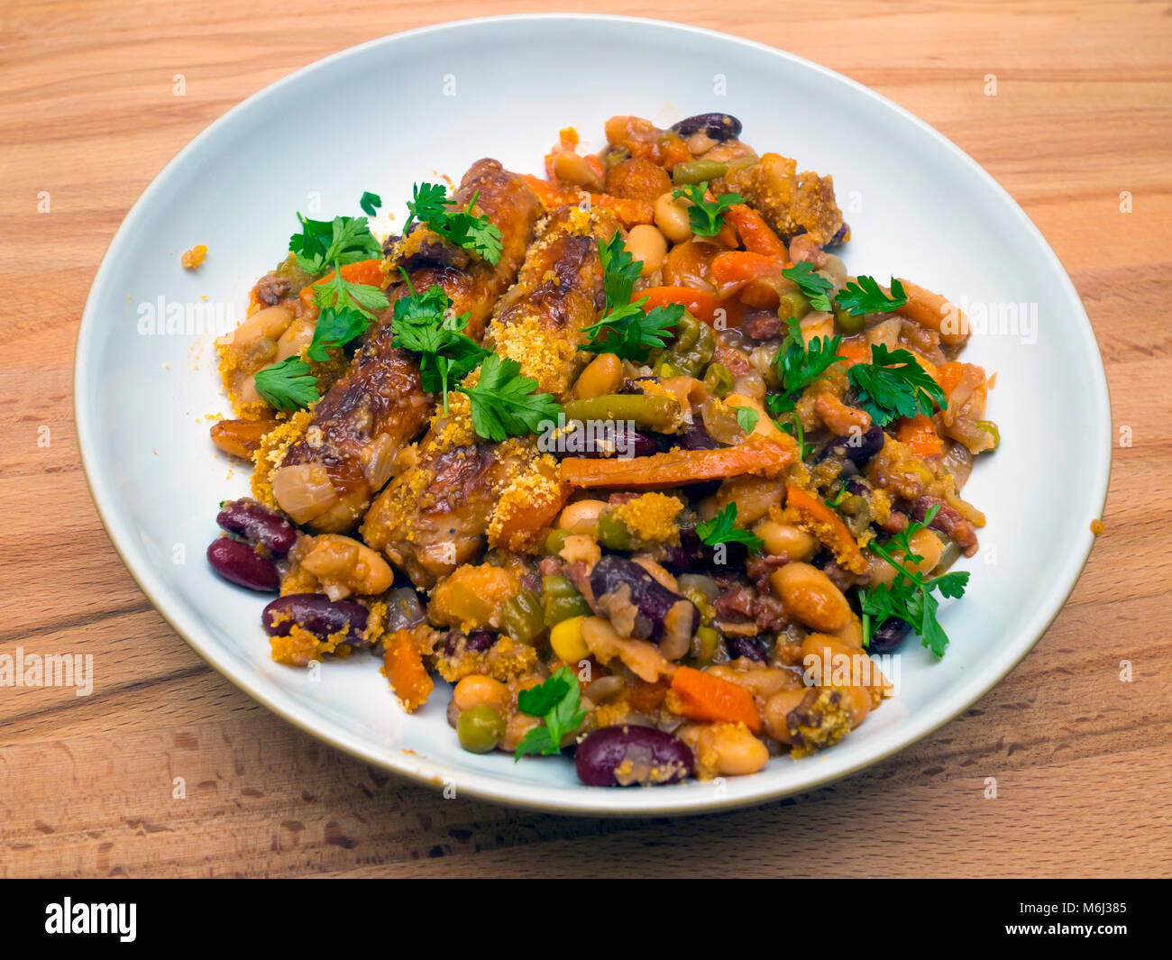 Serving of freshly cooked Cassoulet made from sausages bacon lardons