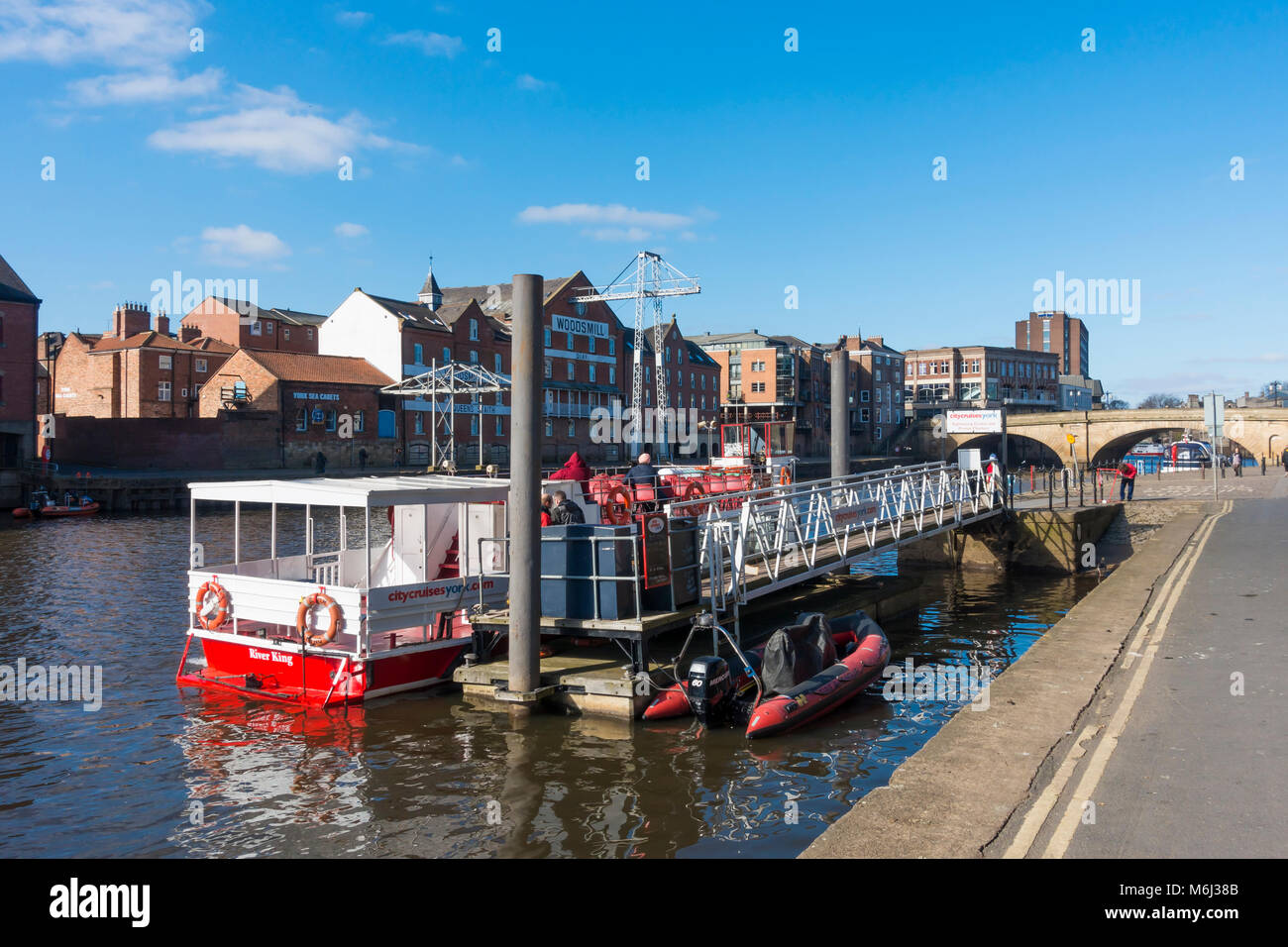 A City Cruise boat moored at  Kings Staith Landing on the River Ouse in York City Centre Stock Photo