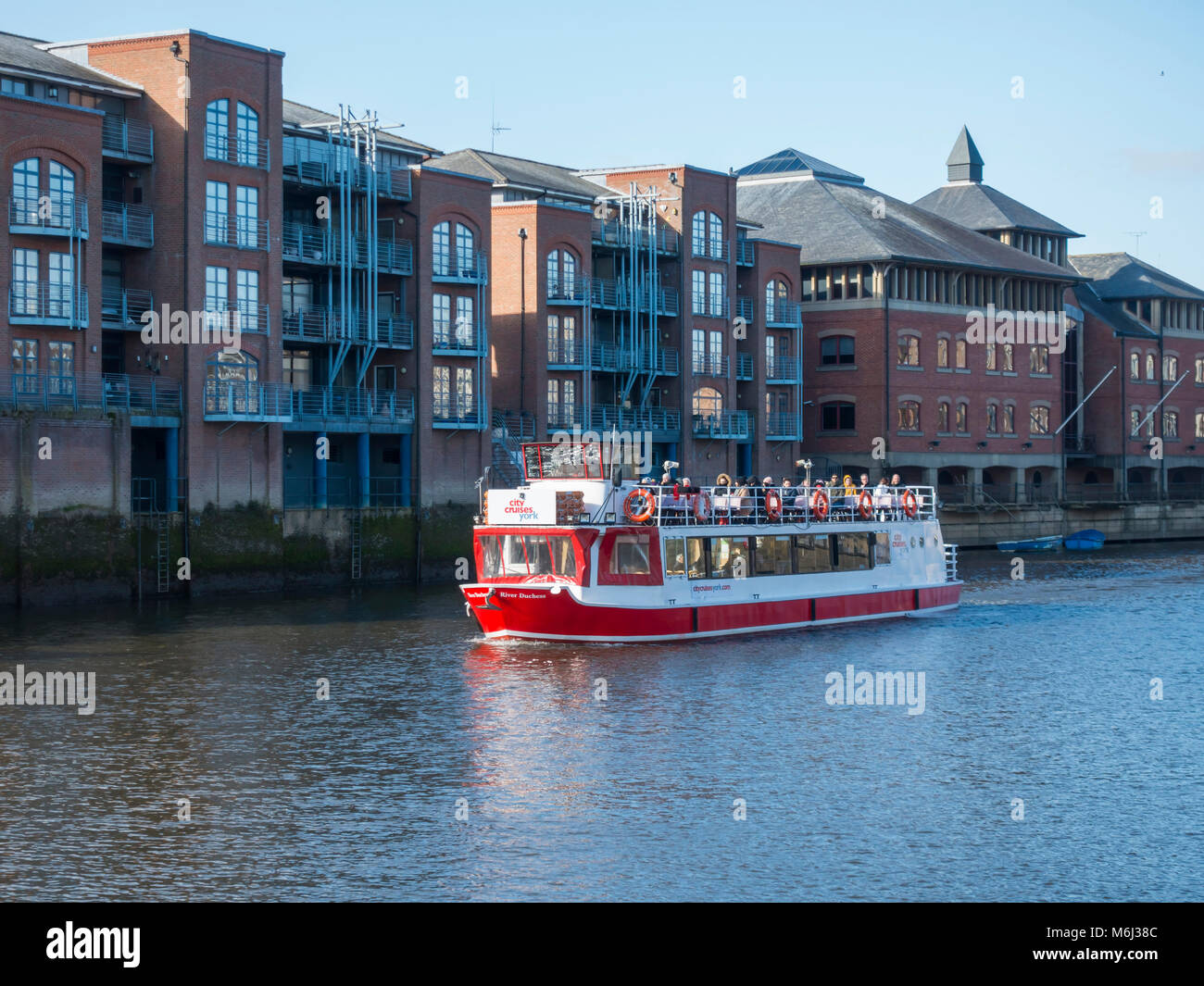 A River Cruise Boat Passing Kings Staith Landing On The River Ouse In 