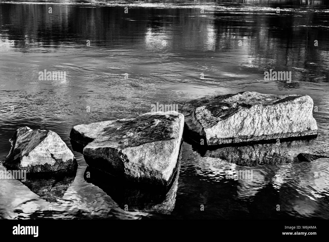 black white stones in the lake kemnade Stock Photo