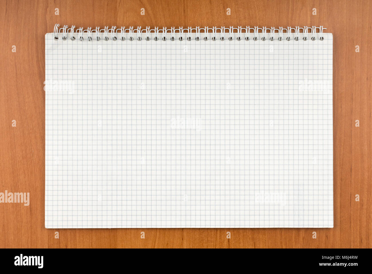 Notepad on a spiral lying on a table. View from above Stock Photo - Alamy