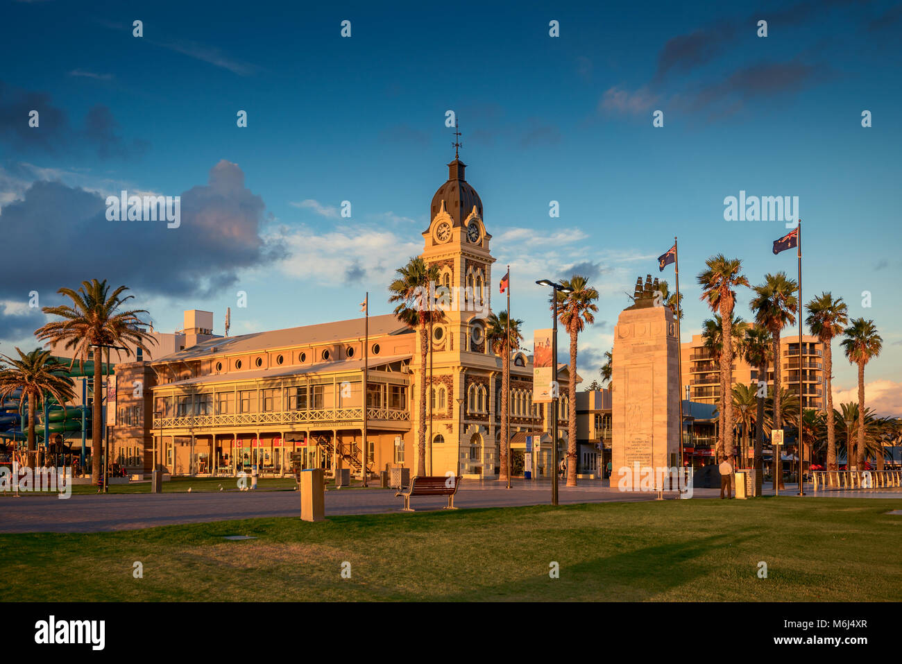 Adelaide, Australia - February 25, 2016: Glenelg Town Hall with Pioneer Memorial viewed through Moseley Square at sunset. Stock Photo