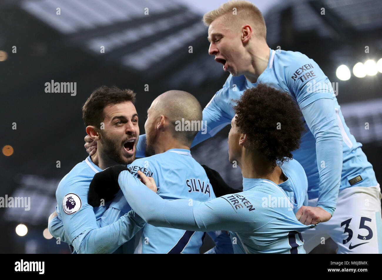 Manchester City's Bernardo Silva (left) celebrates scoring the games