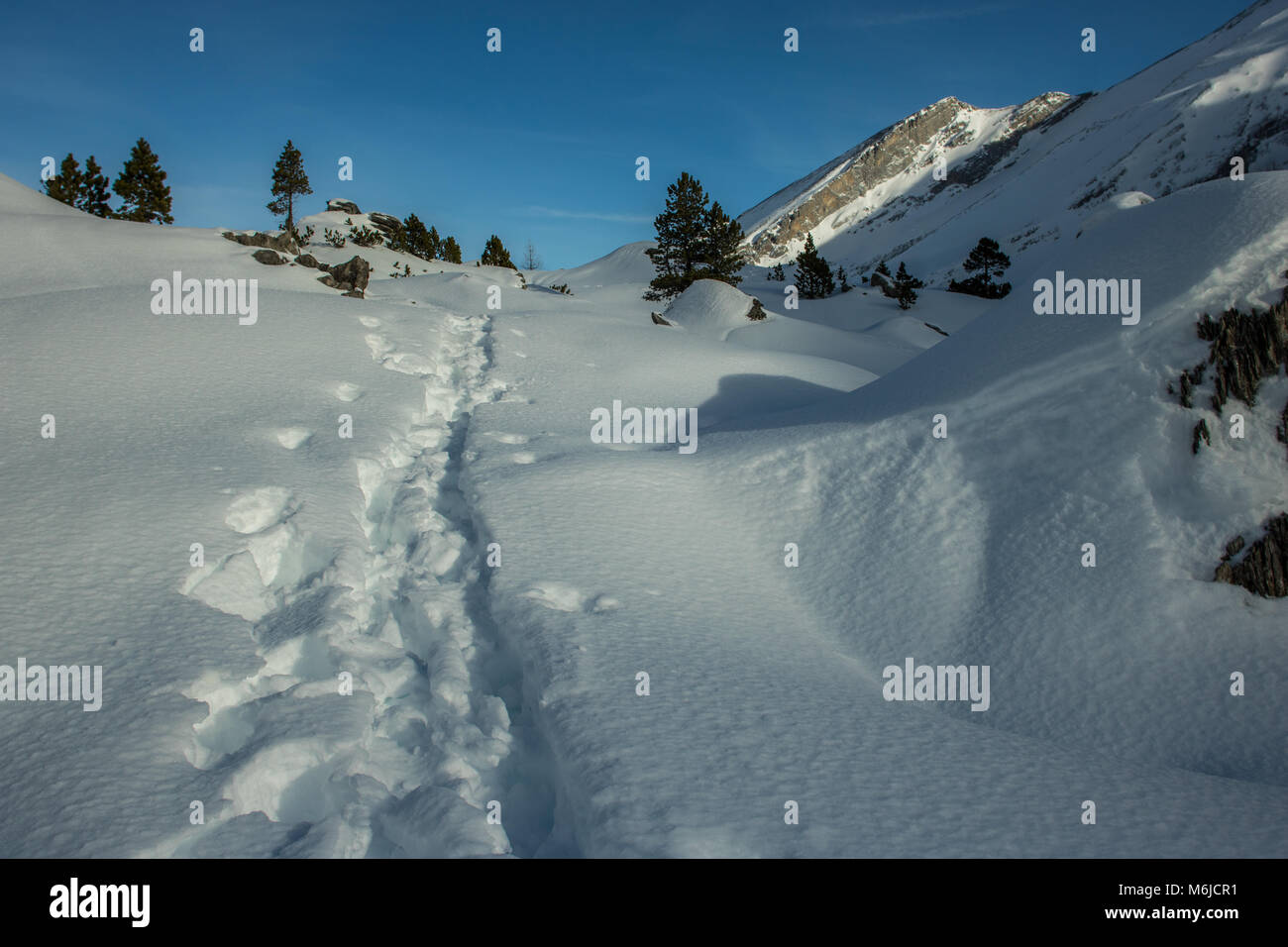A picture of a winter Hike day in the swiss alps Stock Photo - Alamy