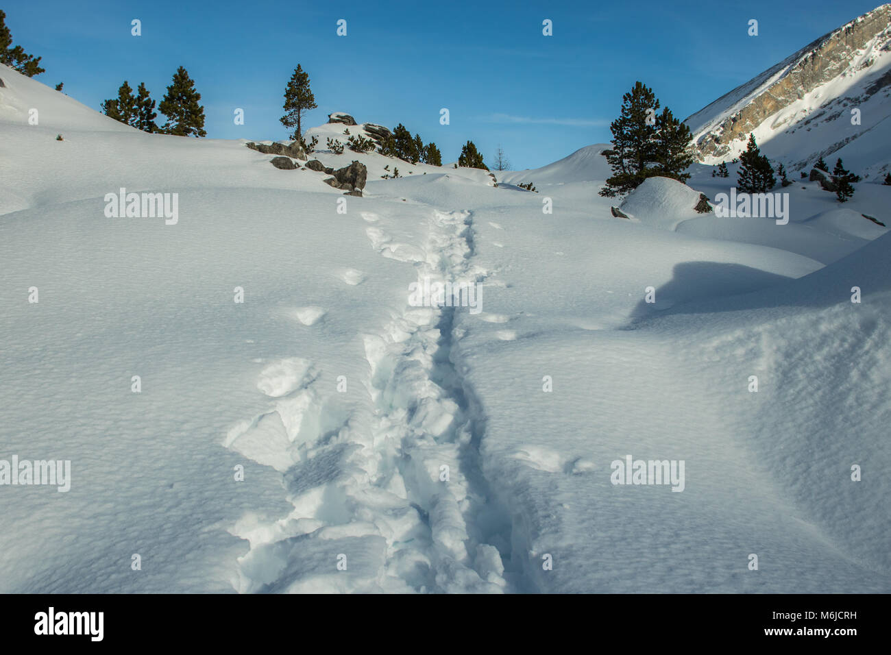 A picture of a winter Hike day in the swiss alps Stock Photo - Alamy