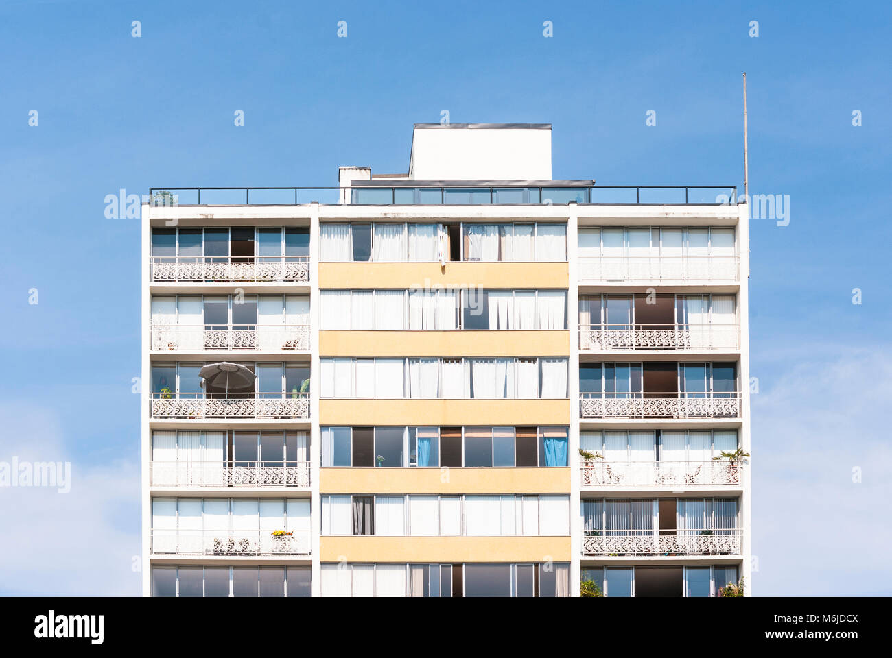 Front of a building with blue sky background Stock Photo - Alamy