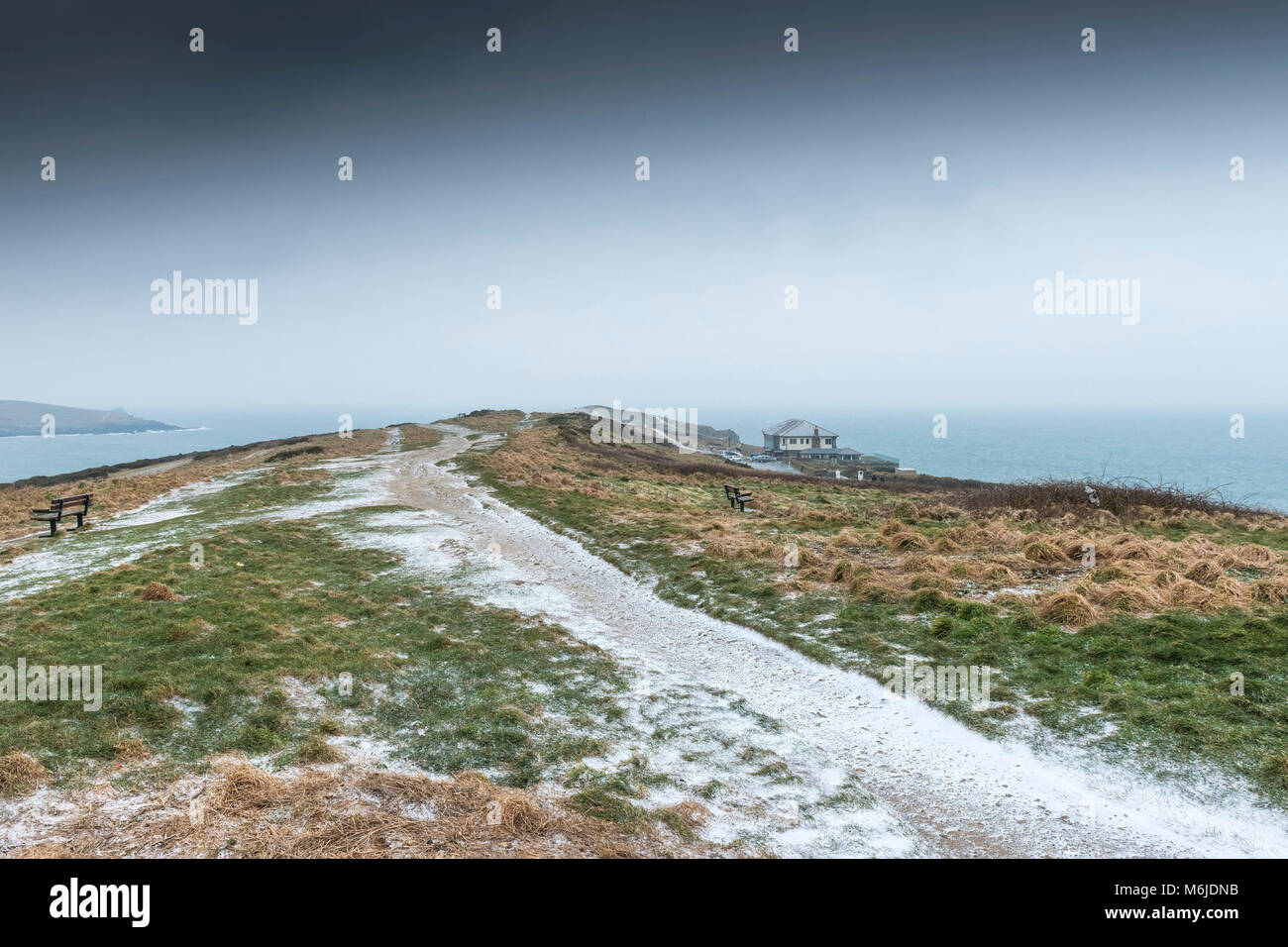 Freezing snow on a path on East Pentire in Newquay Cornwall. Stock Photo
