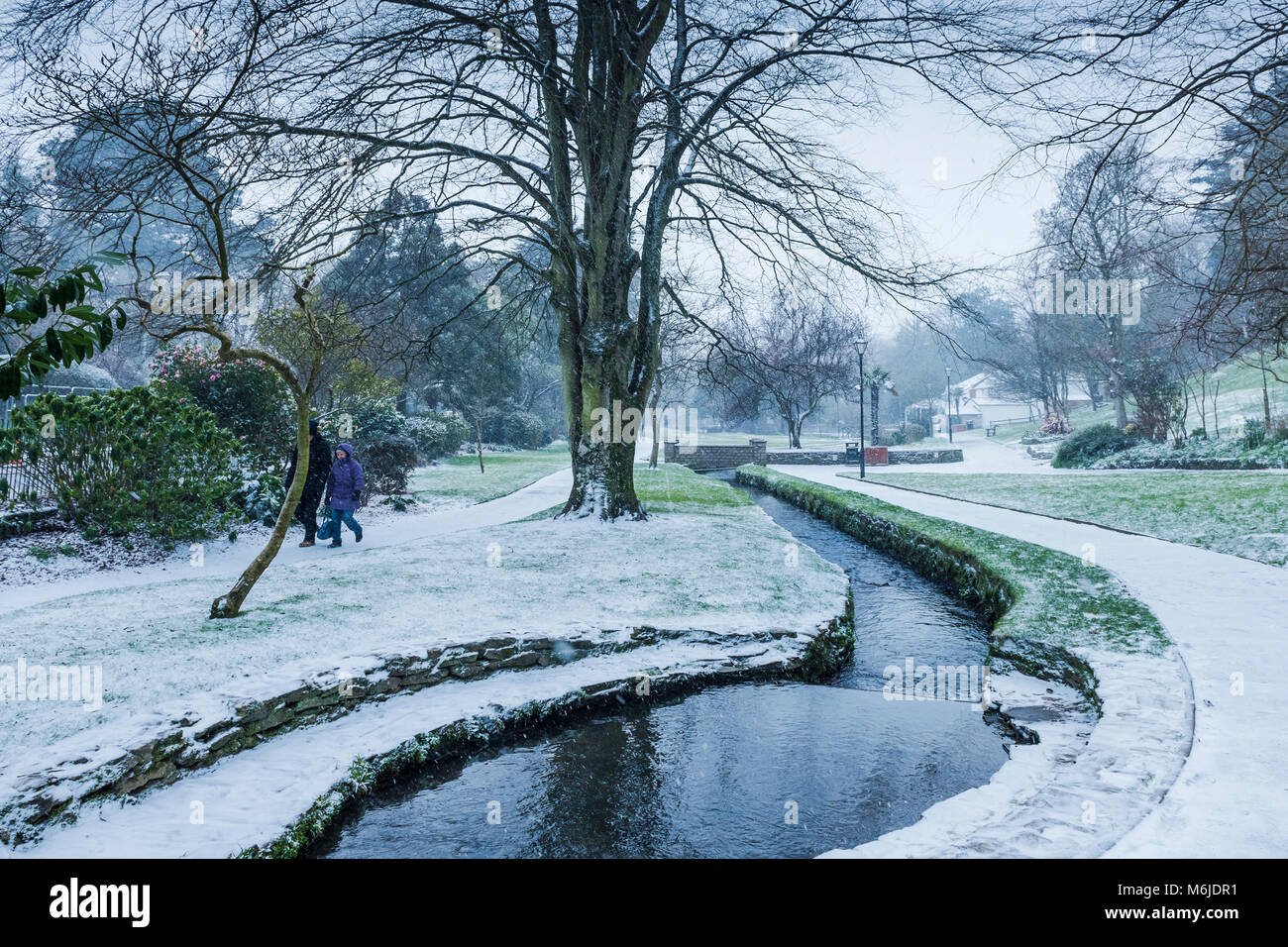 A winter snow scene in Trenance Gardens in Newquay Cornwall Stock Photo