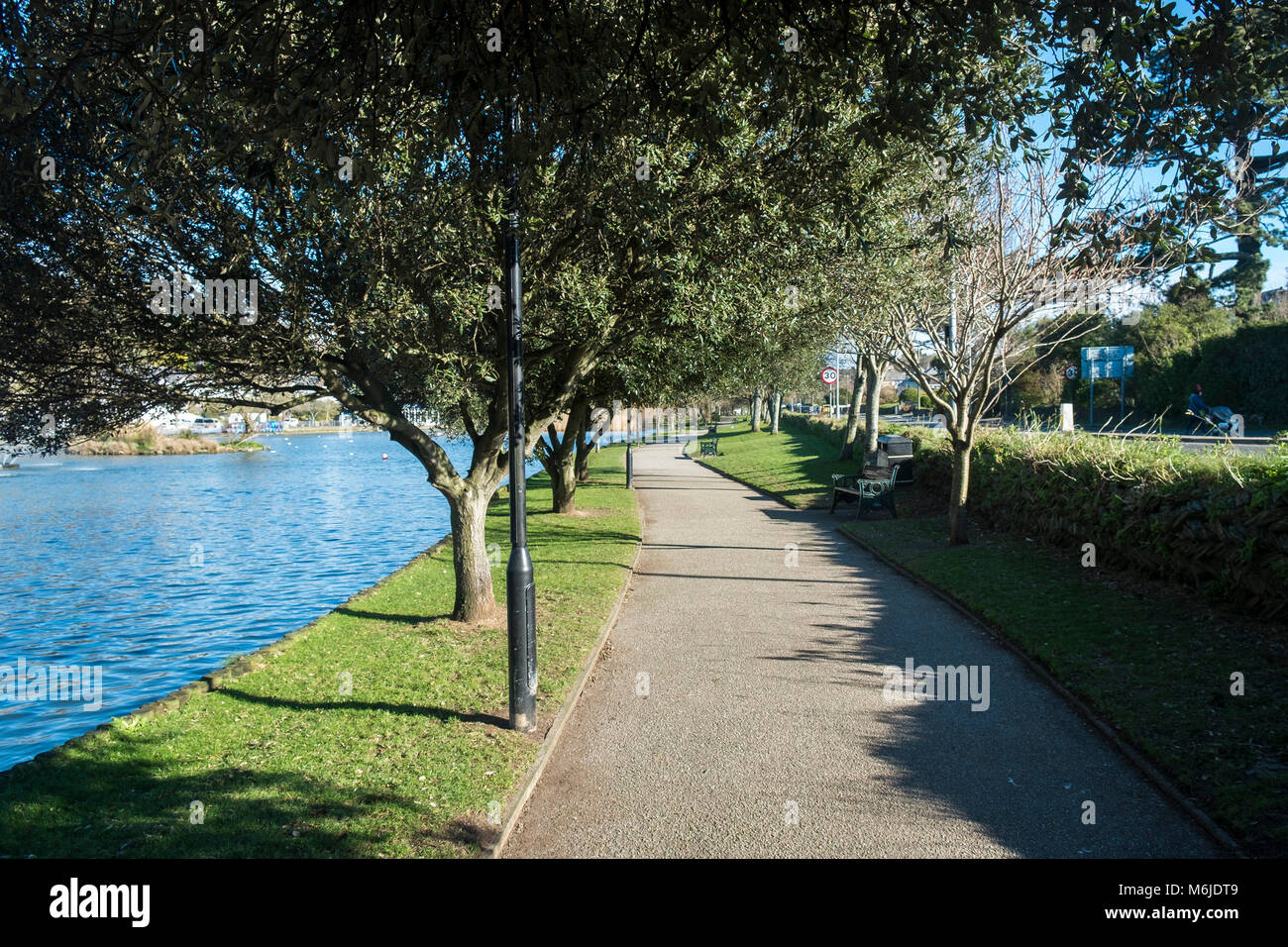 A path alongside Trenance Boating Lake in Newquay Cornwall. Stock Photo