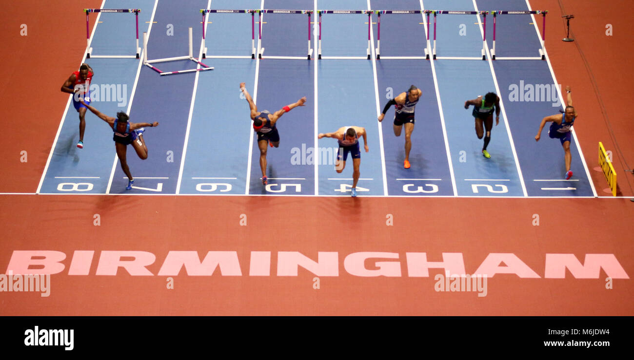 Athletes compete in the final of the Men's 60 metres hurdles during day