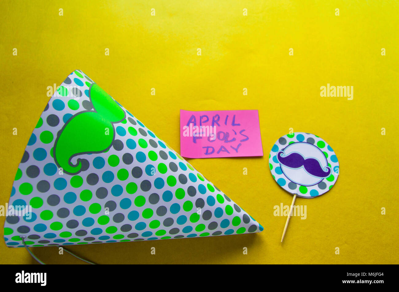 April Topper Cap, topper with a mustache and notes with the phrase April fool's day ...